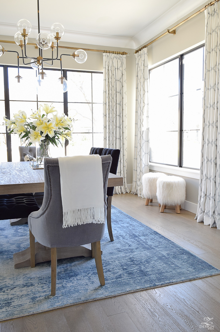 tip to make your home feel cozy and inviting with curtains flowers and art blue vintage inspired rug black tufted dining chairs kravet riad custom curtains sw mindful gray 3